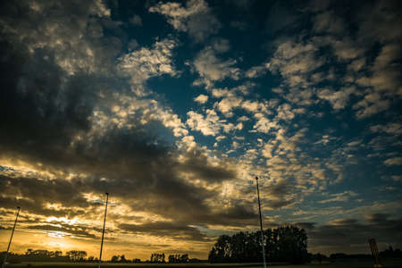 wonderful sunset with natural elements on the road in Europe