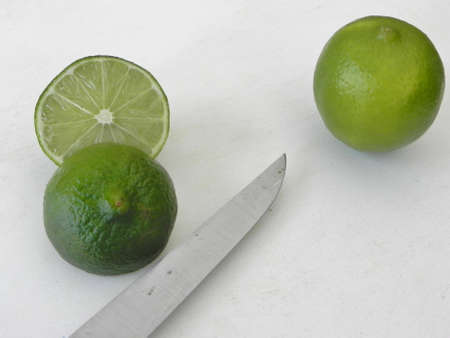 Cut lime with another nearbyの写真素材