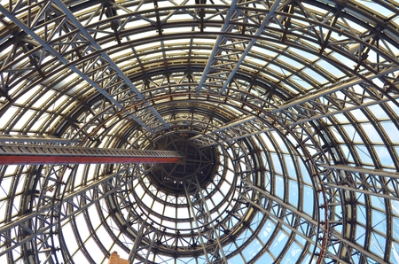Steel girders and beams inside a conical shaped building.の写真素材