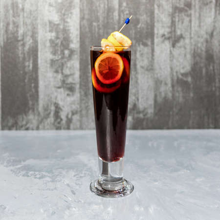 Glass of lemon cocktail isolated on a gray backgroundの写真素材
