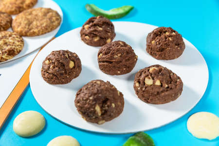 Tasty chocolate cookies on the blue background, close upの写真素材