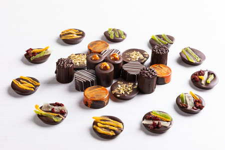 Chocolate pieces on the white background, top viewの写真素材