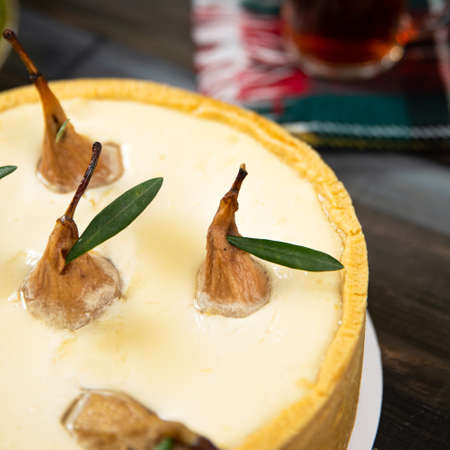 Different beautiful pear cake on the wooden tableの写真素材