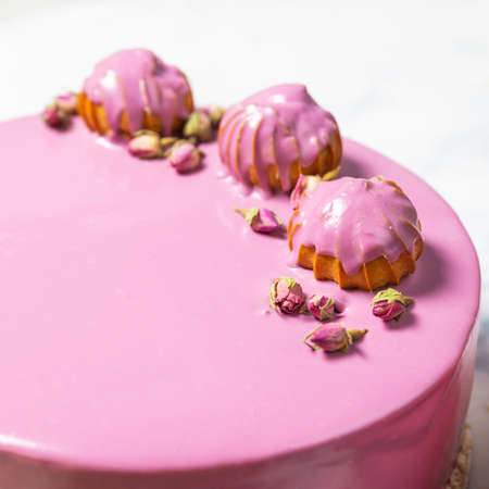 Beautiful pink cream cake on the white background, close upの写真素材