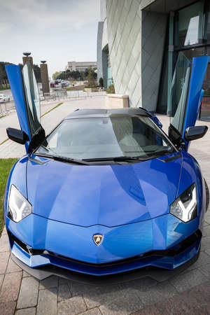 Blue Lamborghini Aventador, doors open