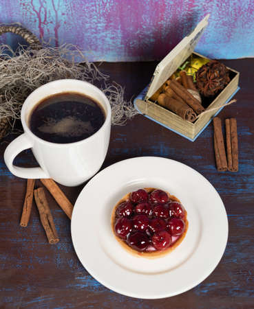 Red tasty cake slice with black coffee