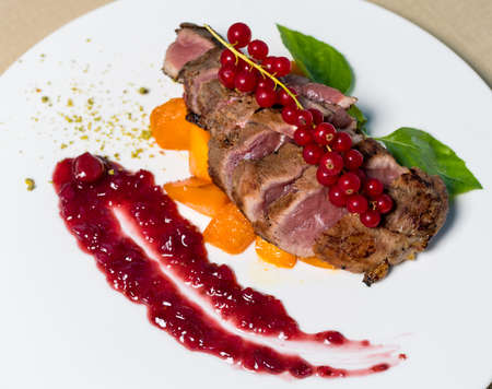 Cooked Steak with Lingonberry on itの写真素材