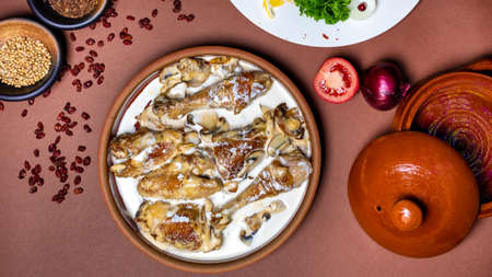 Delicious chicken meat meal with sauce top view