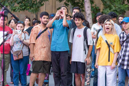 Young fans yelling at the music festival