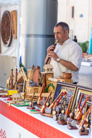 Man performing with fipple flute, dilli kaval, balaban at the exhibitionのeditorial素材