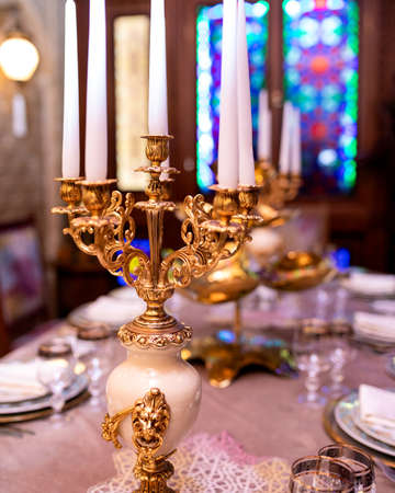 Luxury candle, pots and pans on the table close upの写真素材