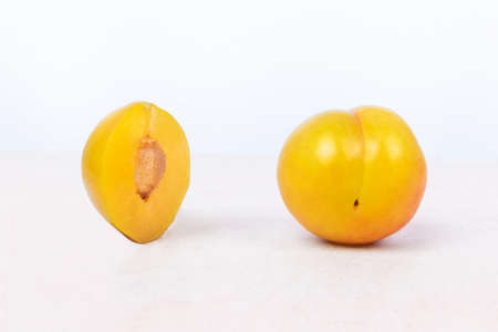 Yellow plum fruit on the white background isolatedの写真素材