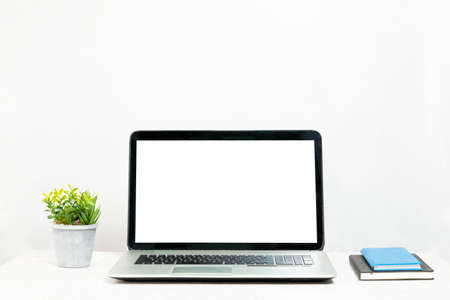 Laptop with a white screen isolated, working deskの写真素材