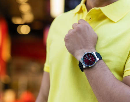 Luxury sport hand watch yellow worn man close upの写真素材