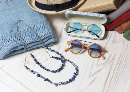 Female sunglasses hat and necklace close upの写真素材