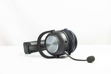 Black wireless headset with a microphone isolated on whiteの写真素材
