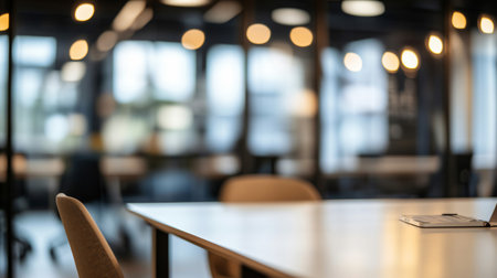 Modern empty open space office interior with nobody present featuring glass walls and a blurred backgroundの素材