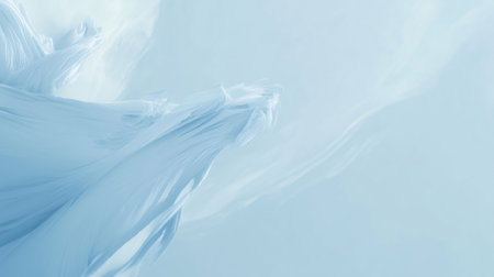 Minimalist abstract background in light blue hues, evoking a serene landscape of snow covered peaks and gentle slopesの素材