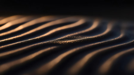 Warm sunlight creates shadows on rippled sand texture, perfect for backgrounds and nature themed projectsの素材
