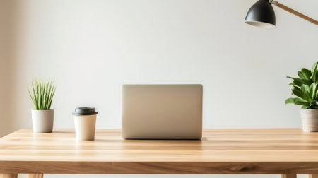 Laptop, coffee and plants on a minimalist wooden desk create a productive and inspiring workspaceの素材