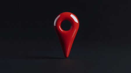 Red map pin pointing destination on digital map with dark backgroundの素材