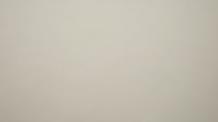 This image features a smooth, seamless beige backdrop with a subtle texture and a soft gradient, perfect for design overlays and versatile applicationsの素材