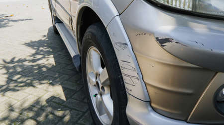 car bumper that was scratched after being hit by another carの写真素材