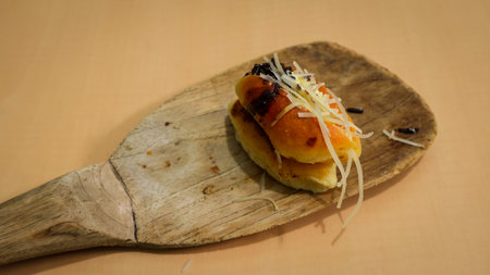 pastry with chocolate and cheese flavor on a wooden tableの写真素材