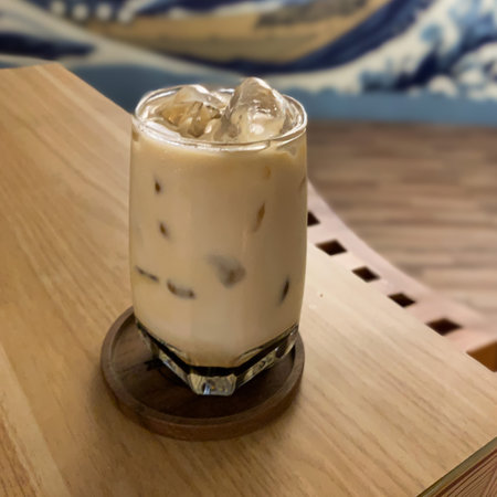 photo during the day a glass of ice cappuccino at a cafe in Malang, East Java