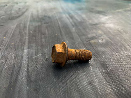 rusty bolts on a gray background