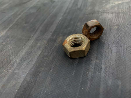 rusty nuts on a gray backgroundの写真素材