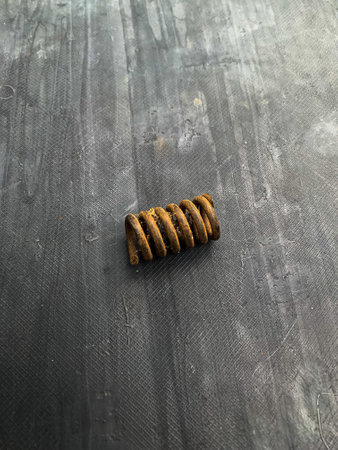 rusty spring iron on gray backgroundの写真素材