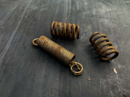 rusty spring iron on gray backgroundの写真素材