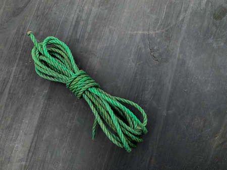 green nylon rope on a gray backgroundの写真素材