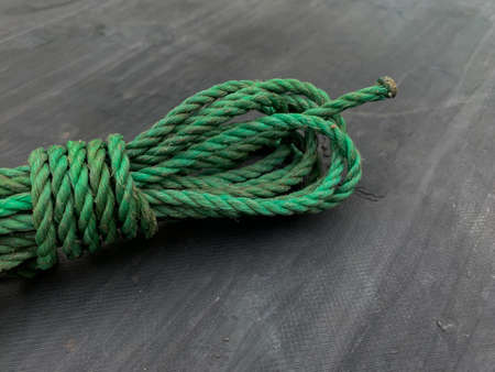 green nylon rope on a gray background