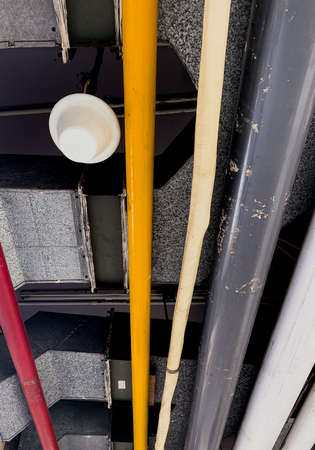 pipes of various colors that connect gas and water in the building