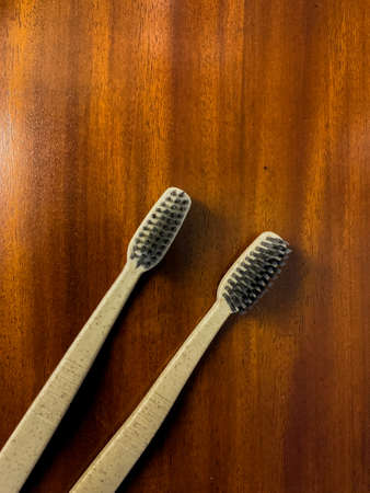 gray toothbrush on a wooden tableの写真素材