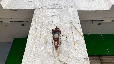 an ancient lamp outside the house that still worksの写真素材