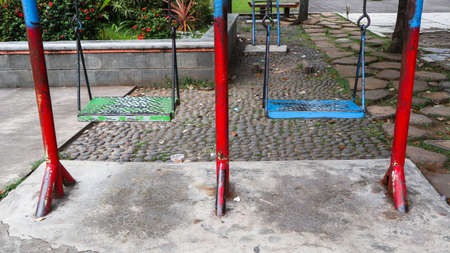 colorful swings in the city park of Sidoarjo, Indonesiaの写真素材