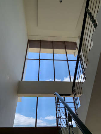 photo showing a blue light outdoors seen from a window in a building in Sidoarjo, East Javaのeditorial素材