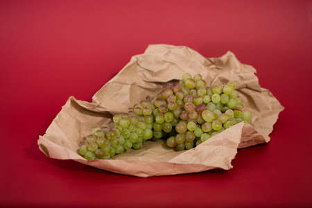 delicious figs on craft paper and purple backgroundの写真素材