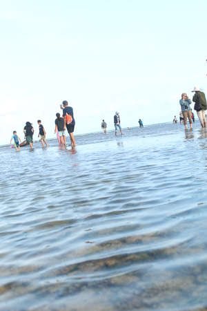 people are seen at the beach in the city of Salvador.