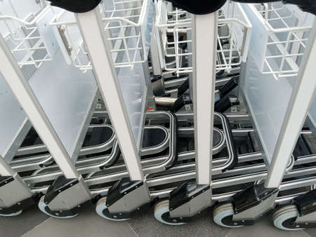 Close-up of luggage carts at the airport. Vacation concept