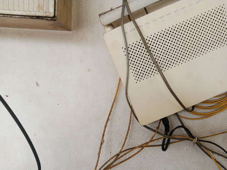 old electrical wiring on the wall of the house, electricity problems concept