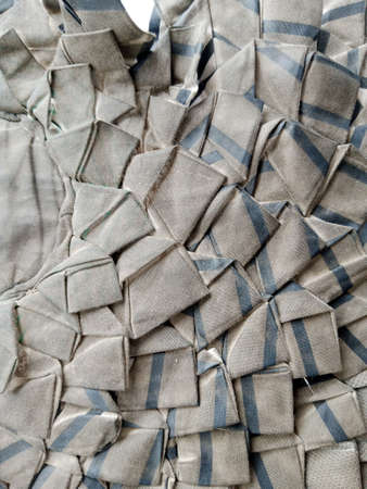 Close-up of a stack of gray and blue checkered napkins