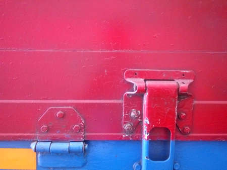 Detail of a red and blue cargo shipの写真素材