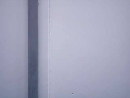 Close-up of a white wall with a black line. Backgroundの写真素材