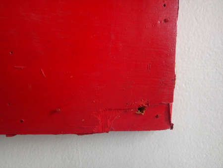 Close-up of red paint on a white wall. Red background.の写真素材