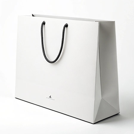 White paper shopping bag on white background. Isolated with clipping path.の素材