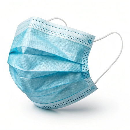 Blue medical mask isolated on white background. Coronavirus concept.の素材